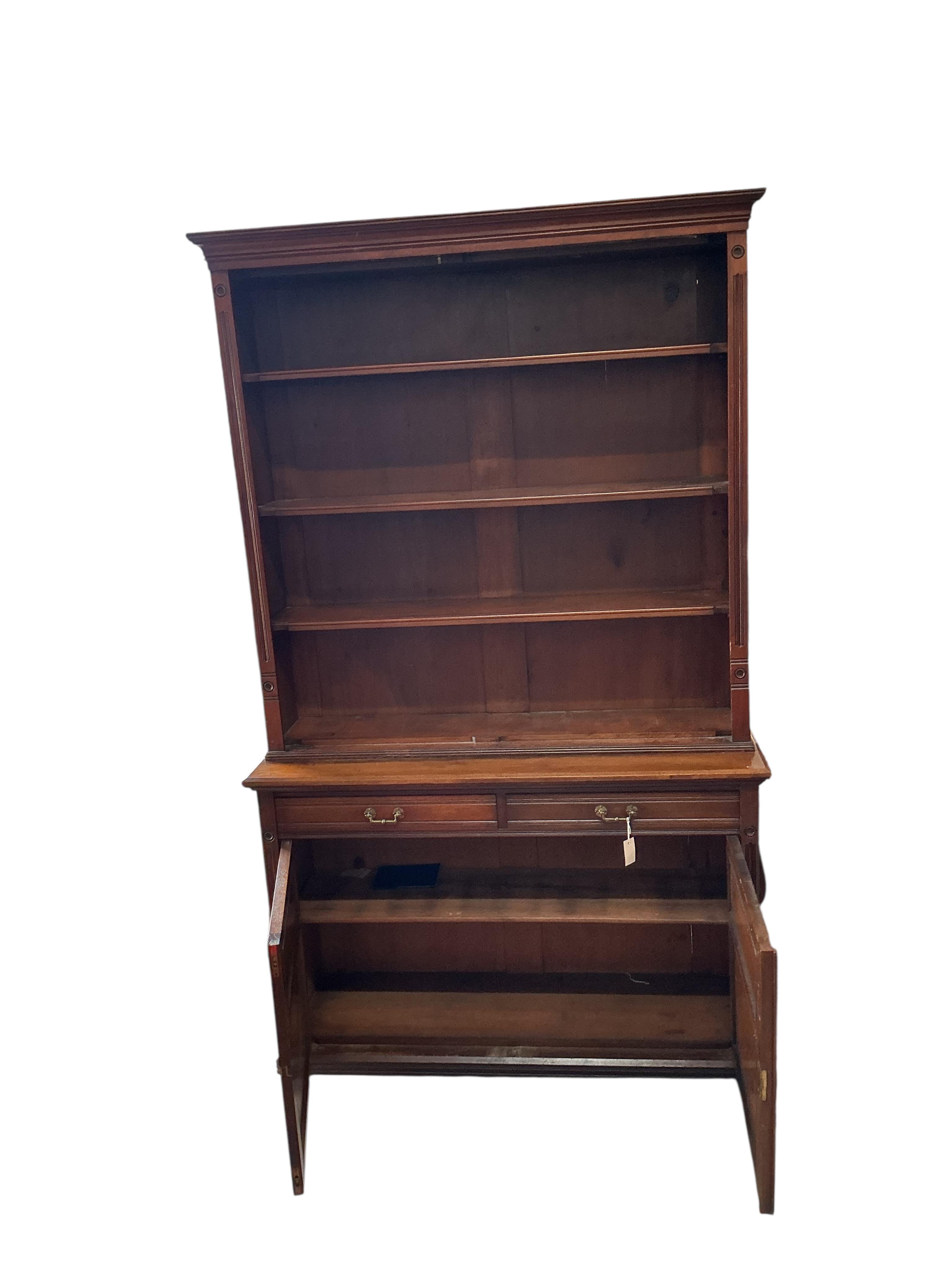A late Victorian oak library bookcase, lacking doors, width 138cm, depth 44cm, height 230cm